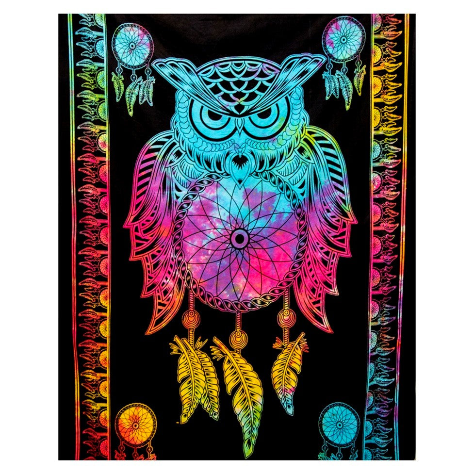 A black tapestry featuring a vibrant, neon rainbow-colored dreamcatcher owl design with matching hanging feathers and circular web motifs.