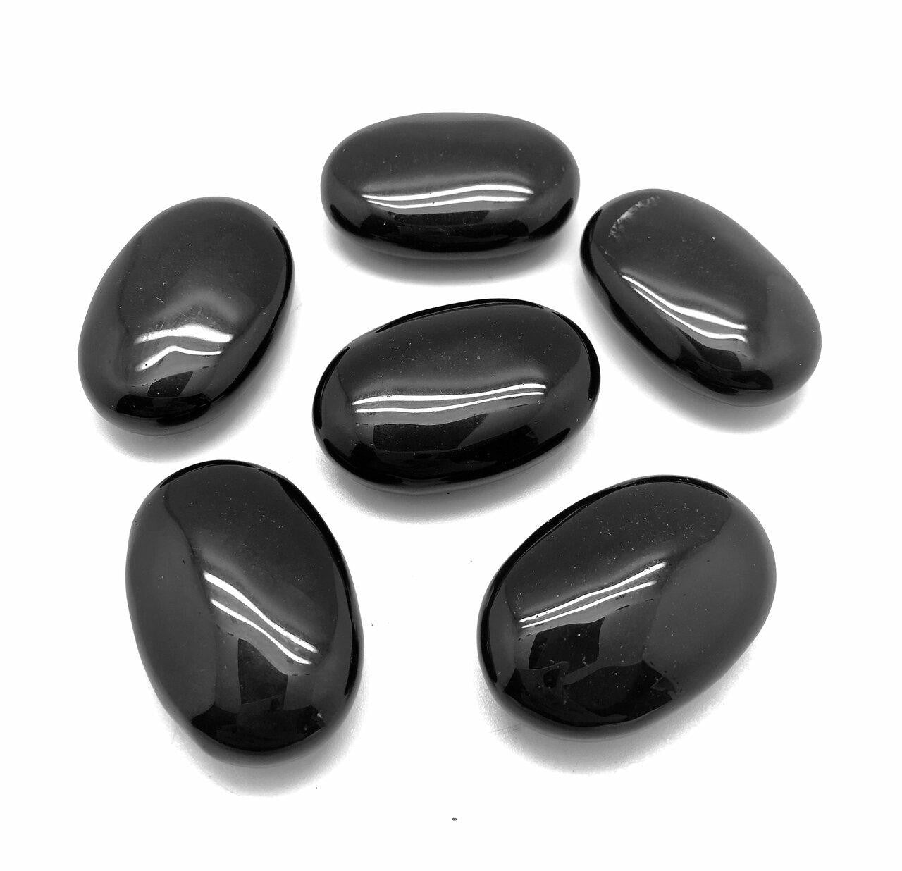 group of six obsidian palm stones