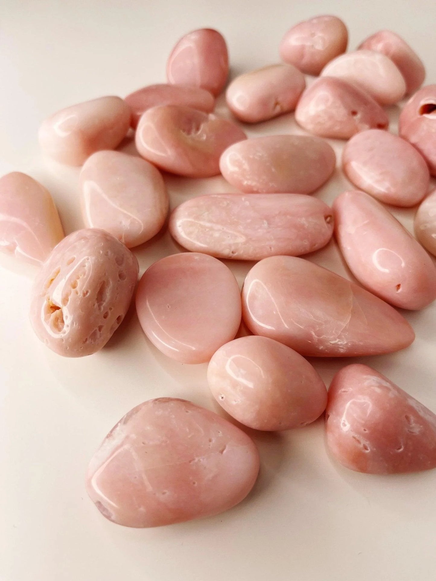 small tumbled smooth pale pink opal stones