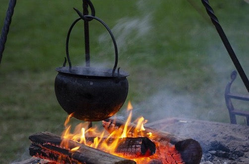 Image of a cauldron over a burning fire
