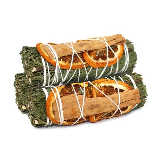 Three Cedar with orange slices and cinnamon stick smudges on white background