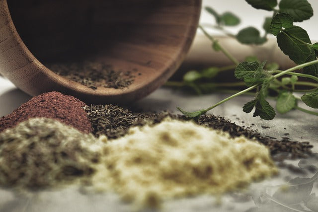 Herbs in piles wood bowl