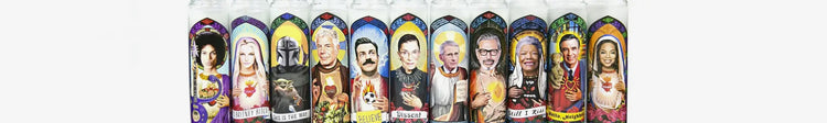 Row of novelty and celebrity saint candles
