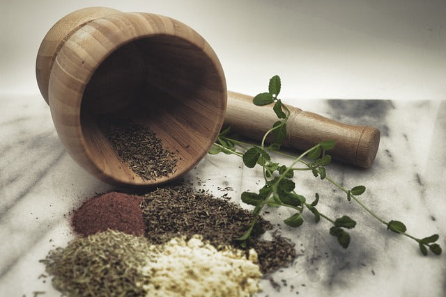 MOrtar and pestle and herbs 