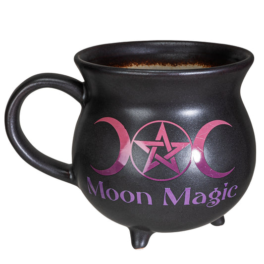 Black mug with purple 'Moon Magic' text and symbols on a white background