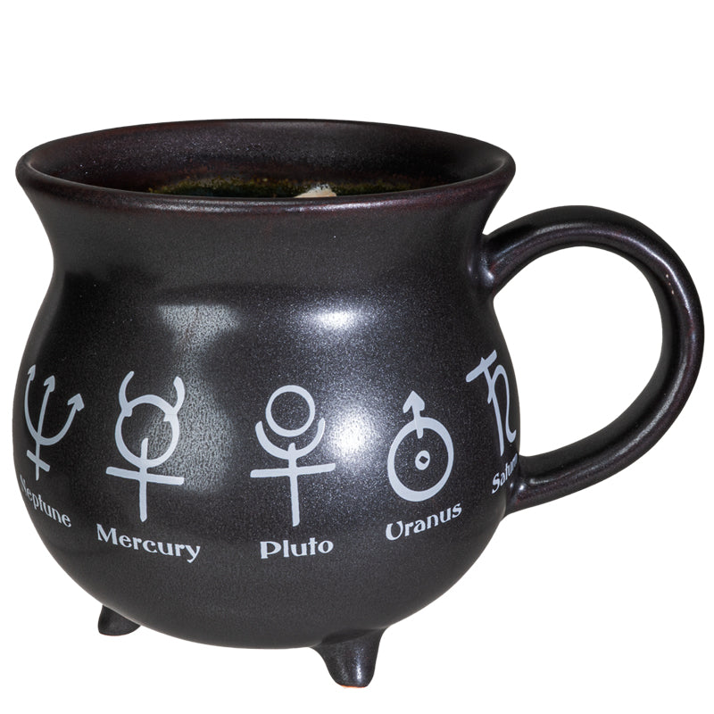 Black mug with astrological symbols and names on a white background