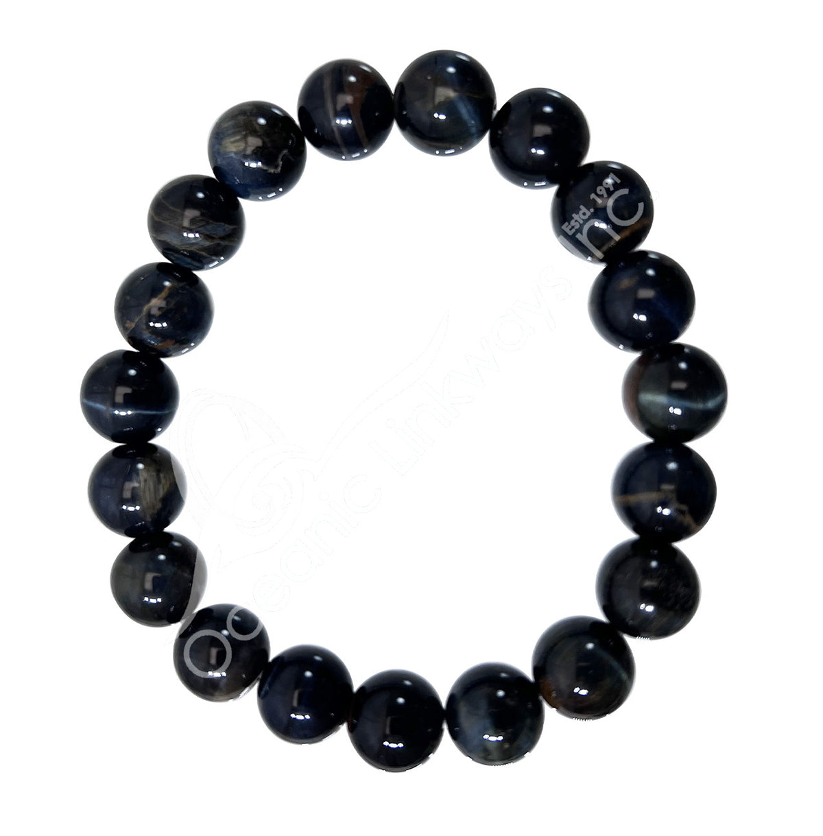 A beaded stretch bracelet made of glossy, dark blue-gray round beads with natural banding, featuring a silver-toned metal charm engraved with 'BREATHE NC'.