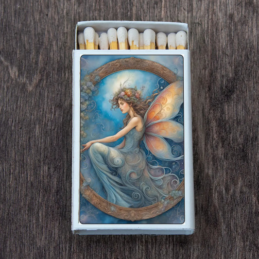 fairy perched inside a wreath like image, blues and oranges.