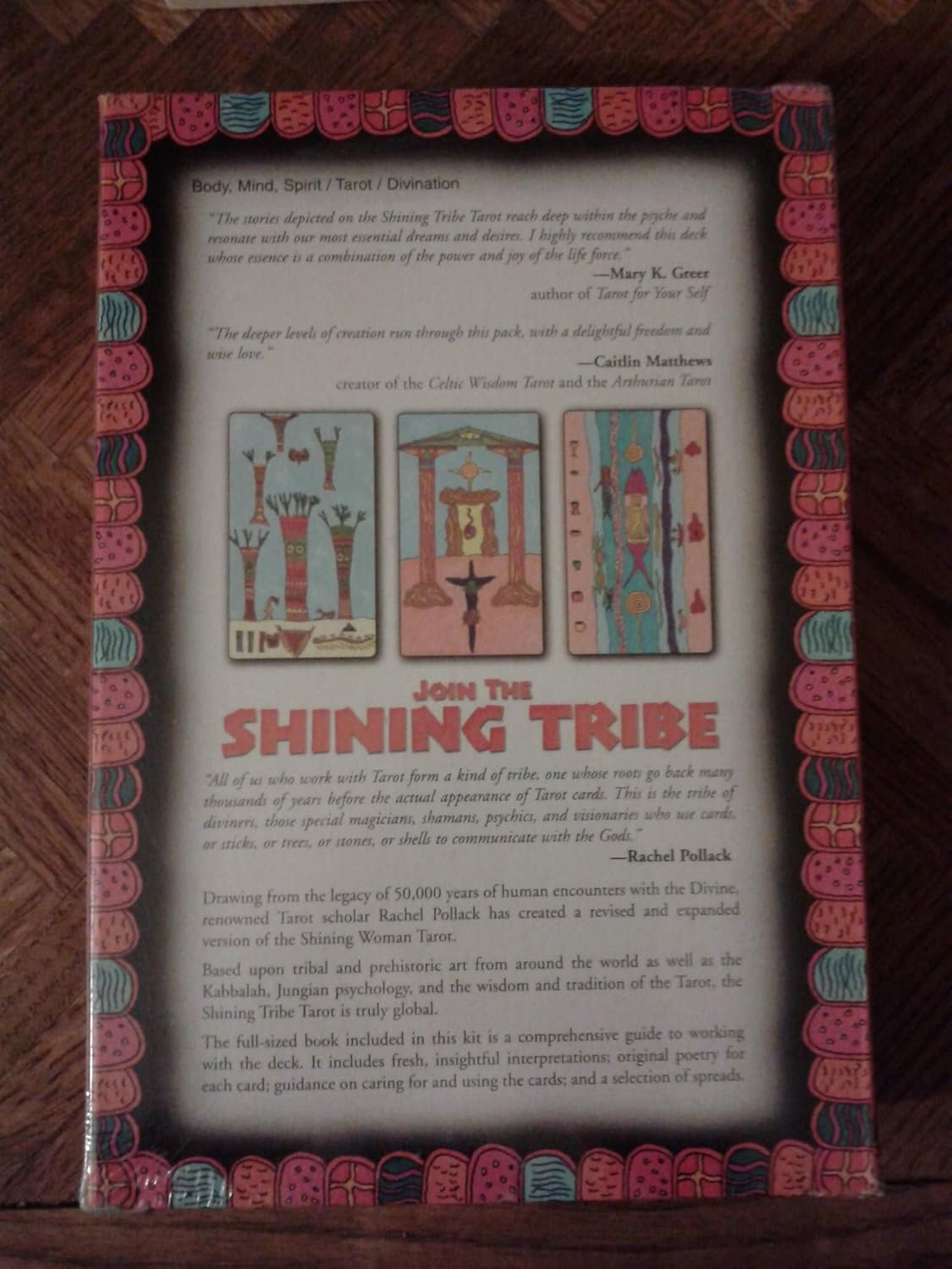 Shining Tribe back of  box with colorful design and text on a wooden surface