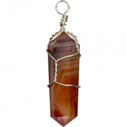 Carnelian crystal pendant with wire wrapping on a white background