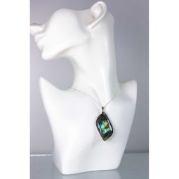 Earring on a white mannequin bust with a gray background