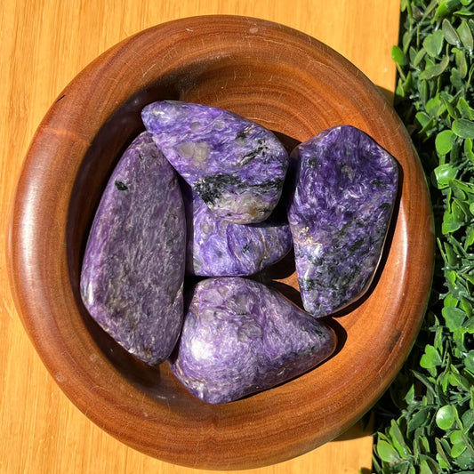 Large tumbled purple stones with black white and silver swirls