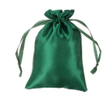 Green drawstring bag on a white background