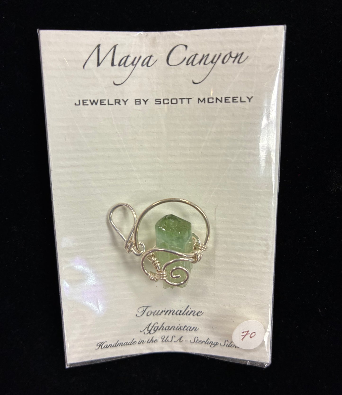 Green Tourmaline Pendant wrapped in sterling silver pendant form.