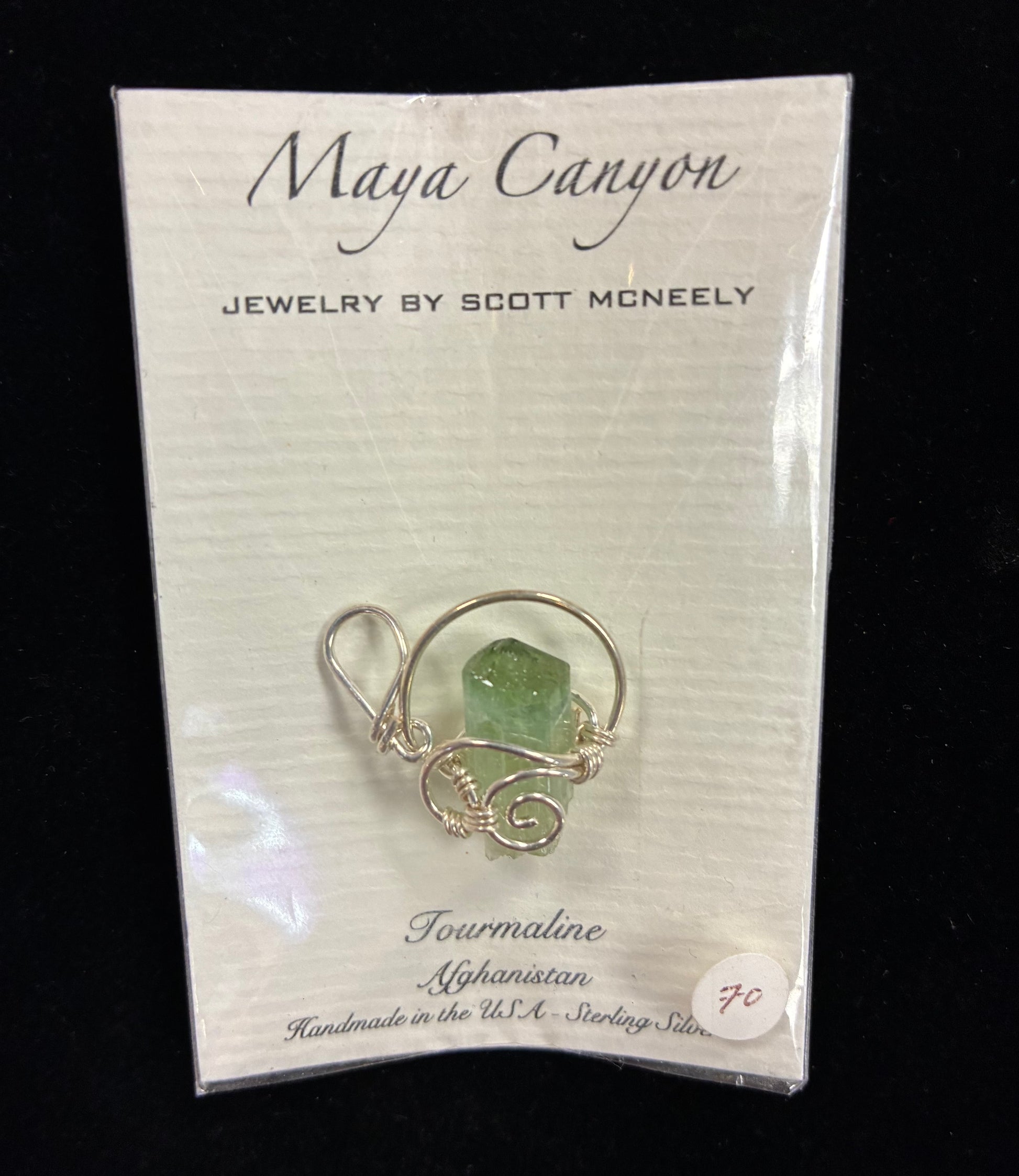 Green Tourmaline Pendant wrapped in sterling silver pendant form.