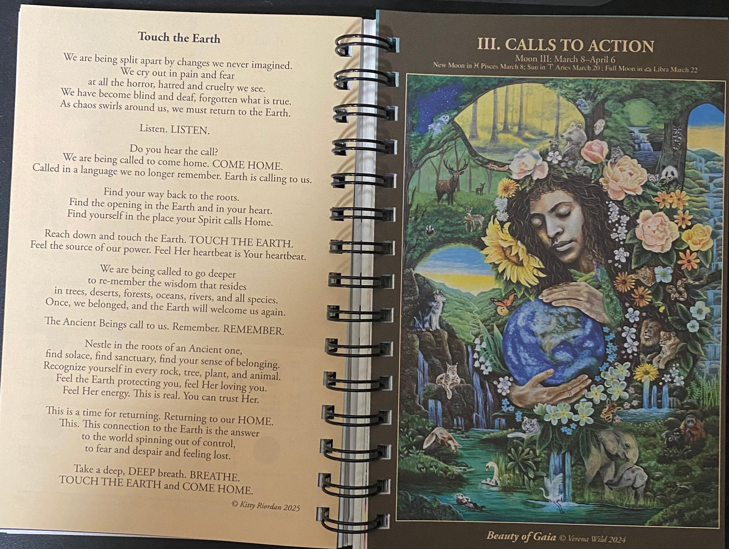 A spiral-bound booklet or prayer card set shown open to two pages. The left page contains a poem titled 'Touch the Earth' in black text on a white background.