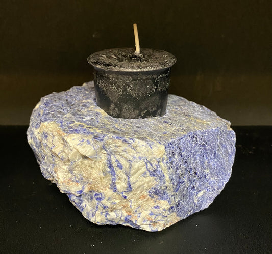 Candle Holder Sodalite rough shaped displaying a black candle