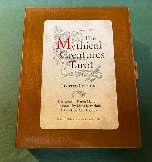 brown wooden box with title and unicorn head