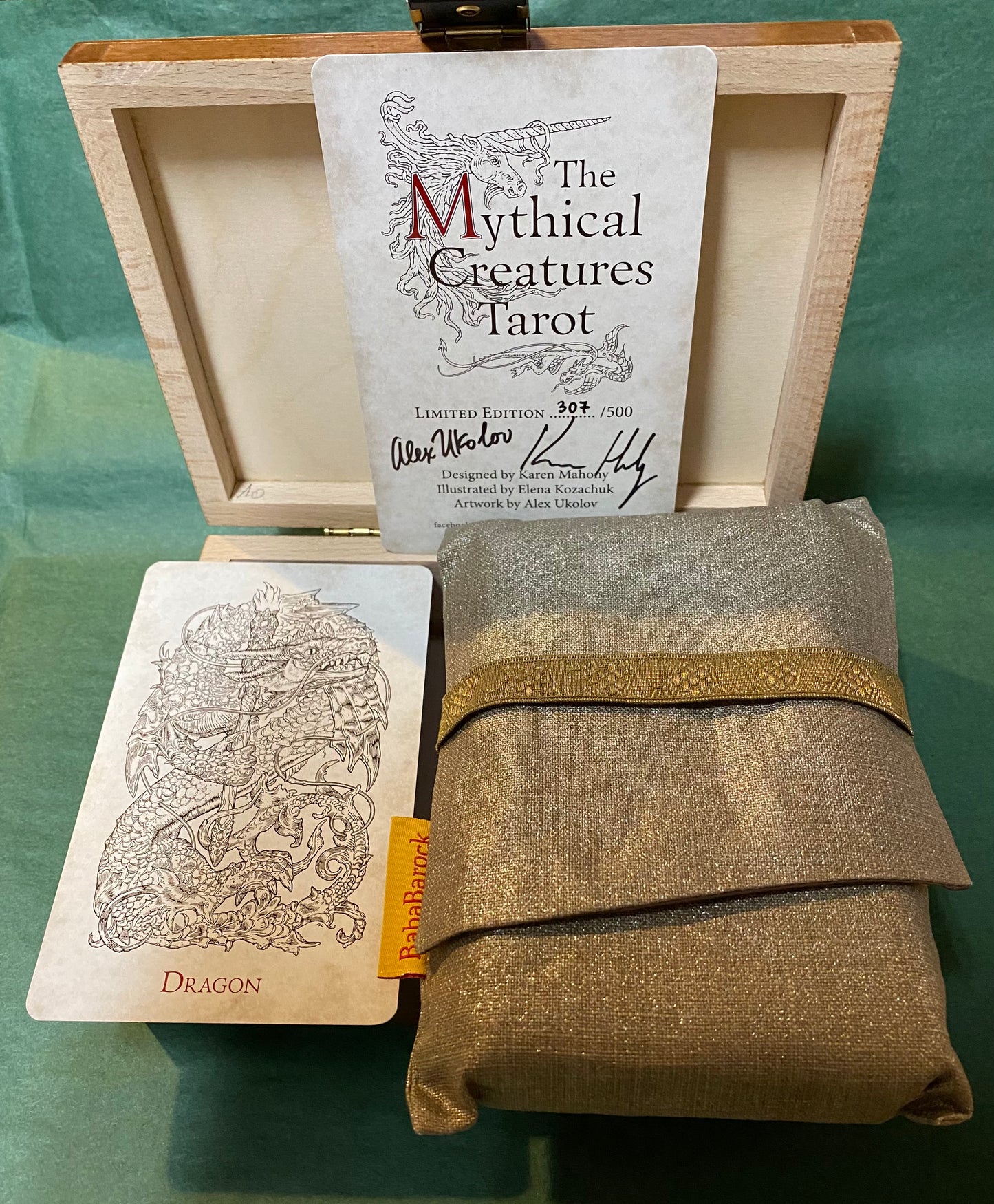 contents of box; dragon tarot card (monochrome) taot ba and authenticity card.
