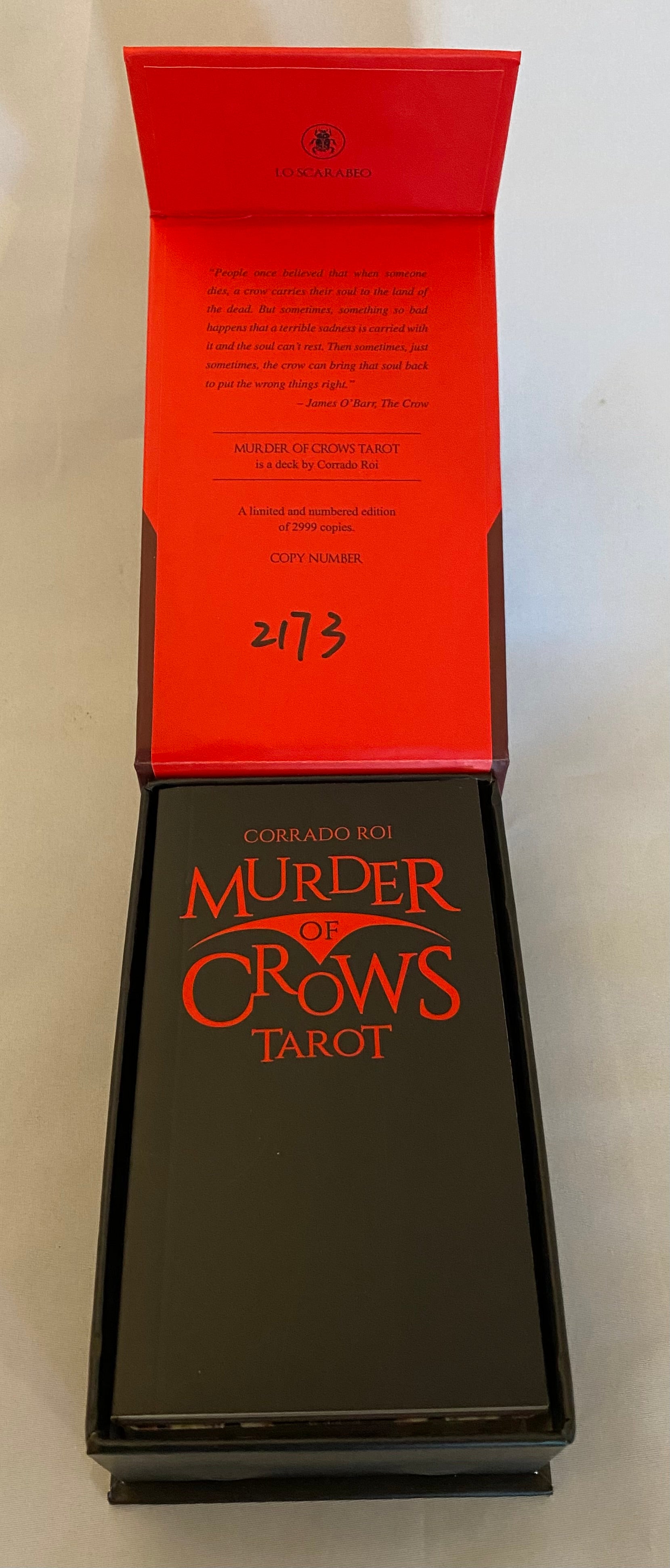 Black box with 'Murder of Crows Tarot' text on a white background