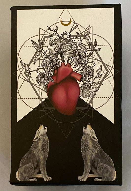 Artistic design with a heart, wolves, and floral elements on a black background