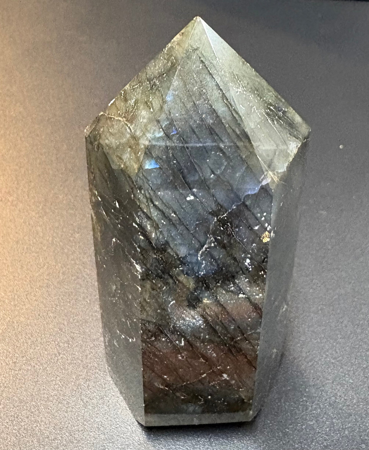 Labradorite tower on black background