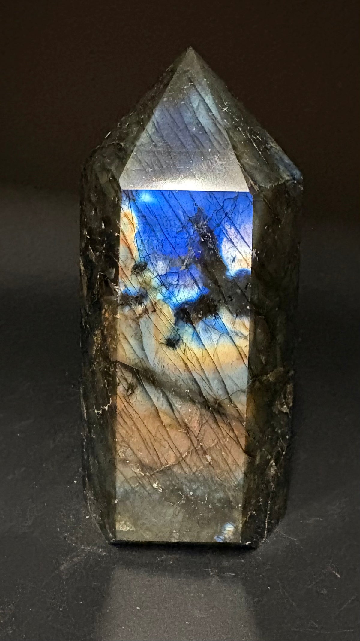 Labradorite tower on black background