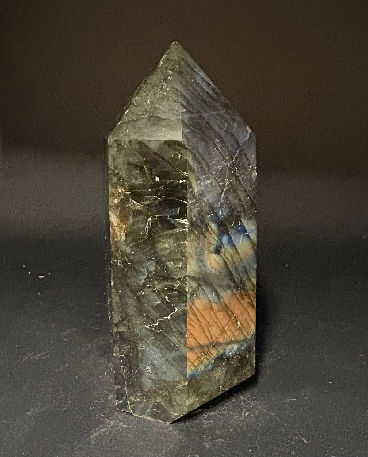 Labradorite tower on black background