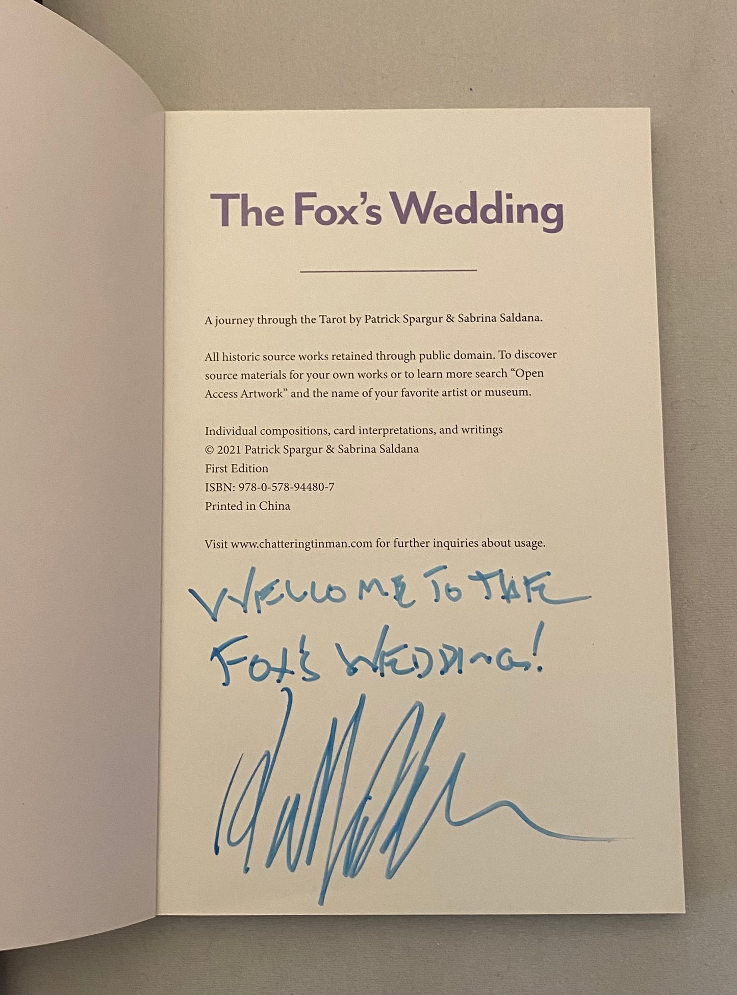 Booklet titled 'The Fox's Wedding' with text and a signature on a plain background