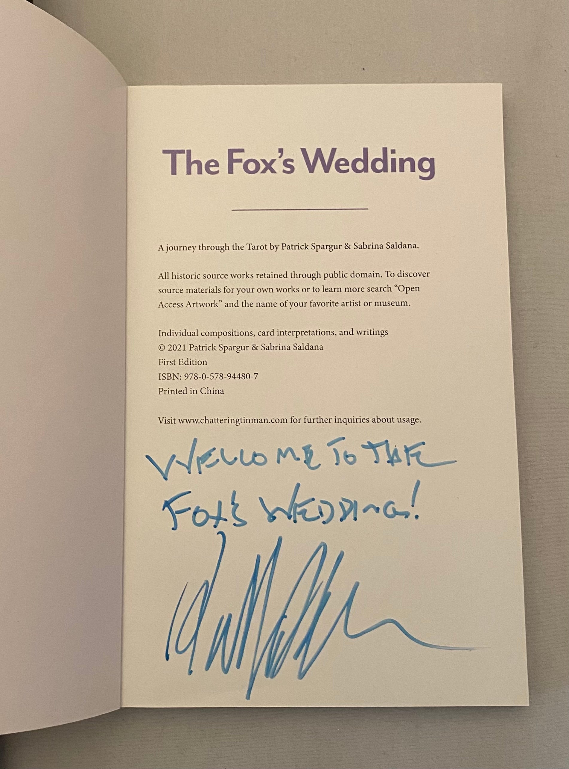 Booklet titled 'The Fox's Wedding' with text and a signature on a plain background