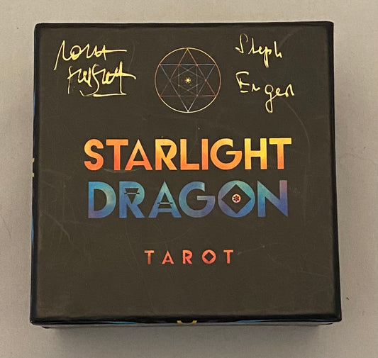 Starlight Dragon Tarot box with signatures on a gray background