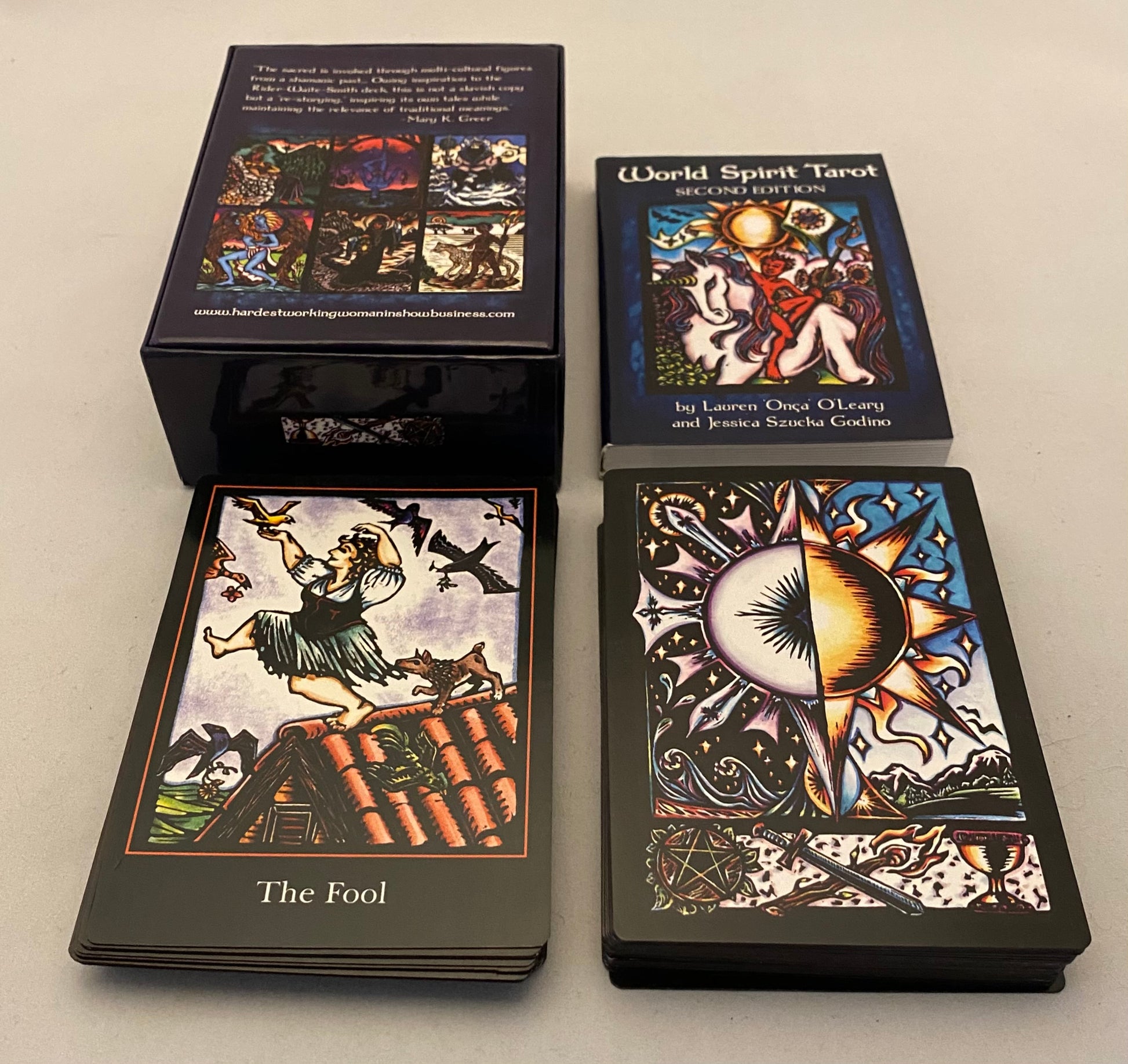 World Spirit Tarot cards with tarot card and box packaging on a neutral background