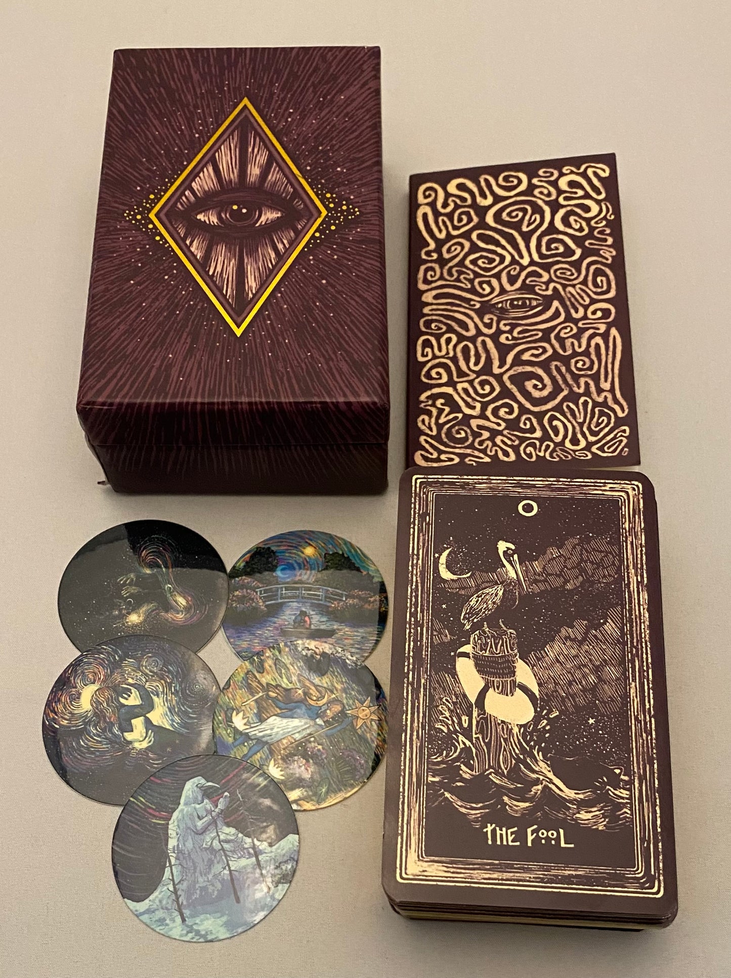 Tarot card set with decorative box and cards on a neutral background