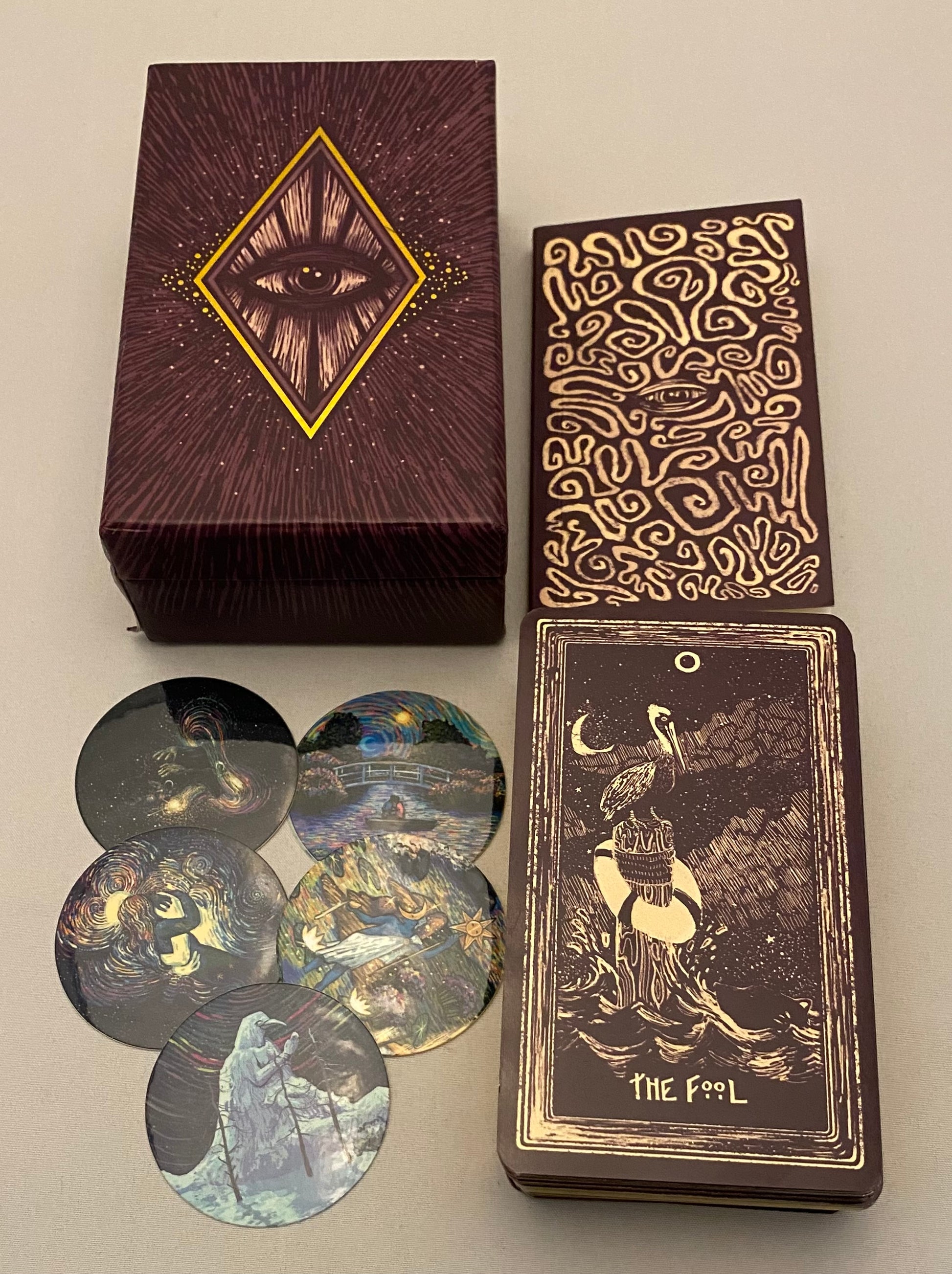 Tarot card set with decorative box and cards on a neutral background