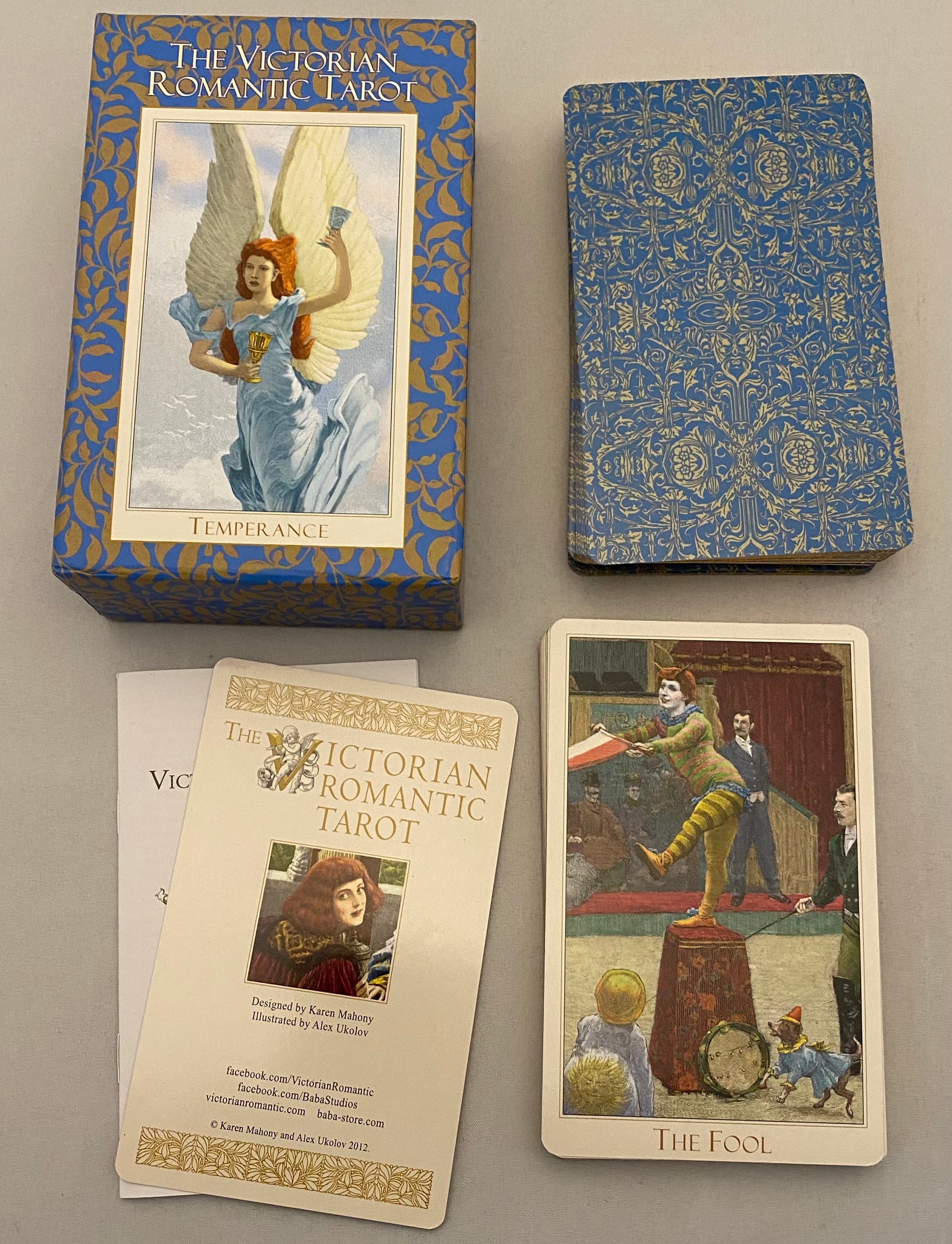 Victorian Romantic Tarot set with cards and box on a gray surface