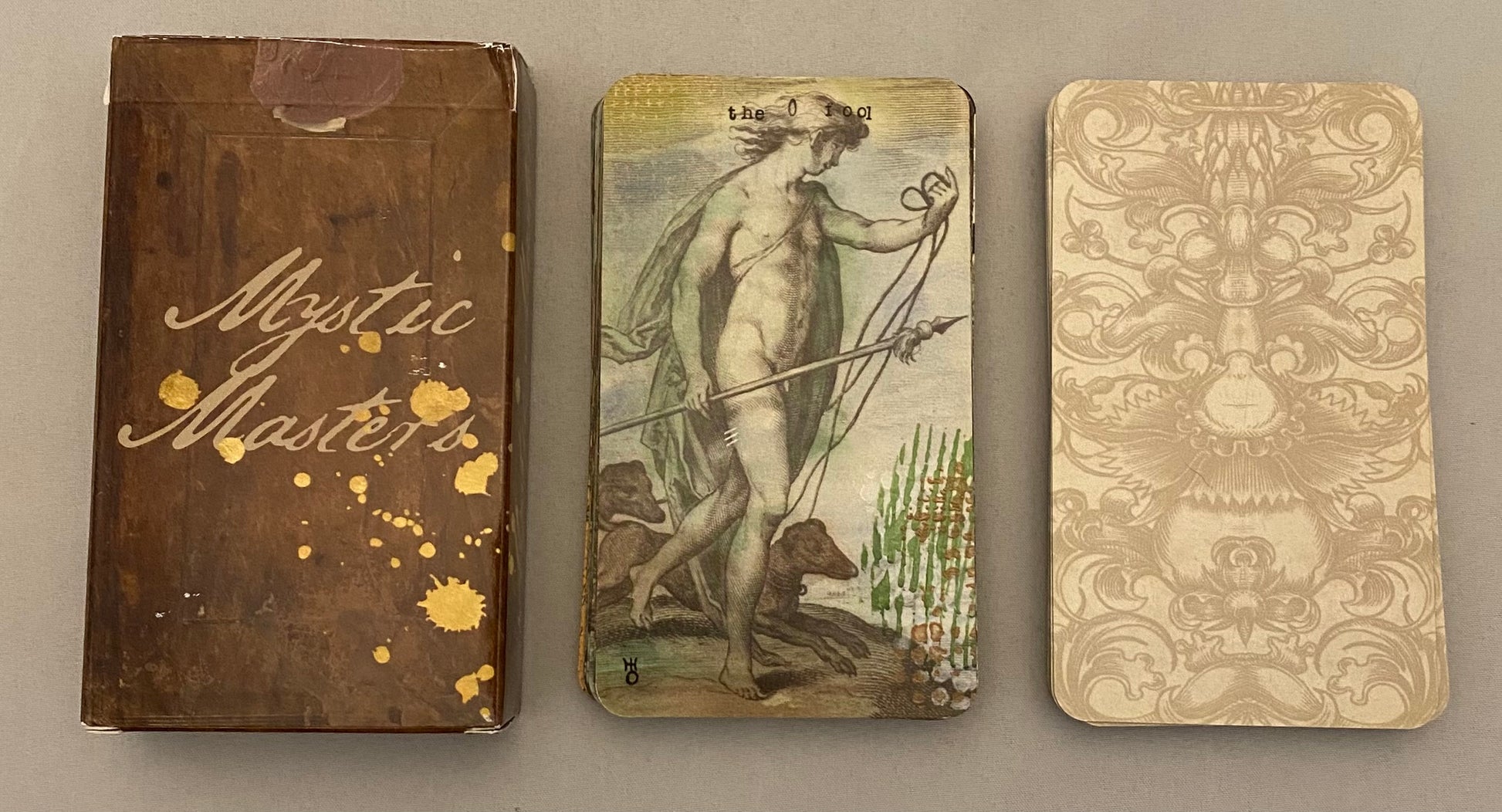 Mystic Masters box with illustrations of the fool on a gray background