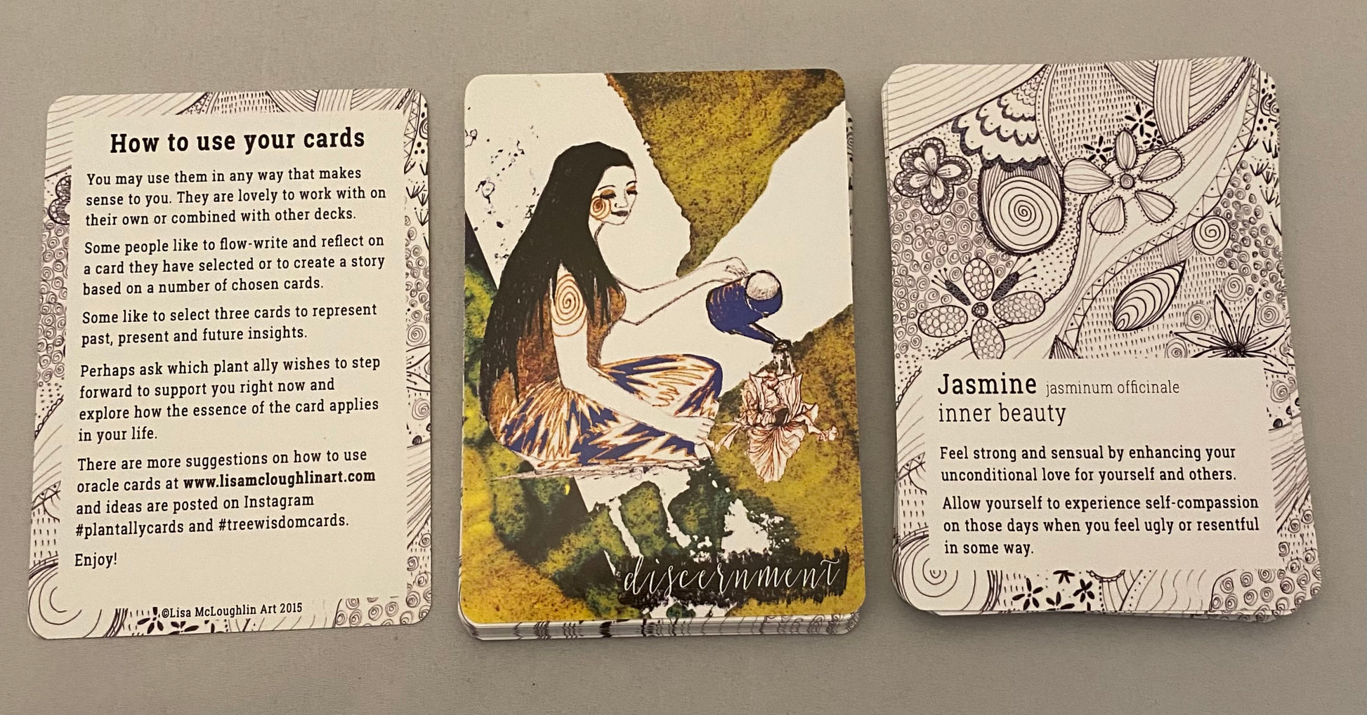 Three tarot cards on a beige background with text and illustrations.