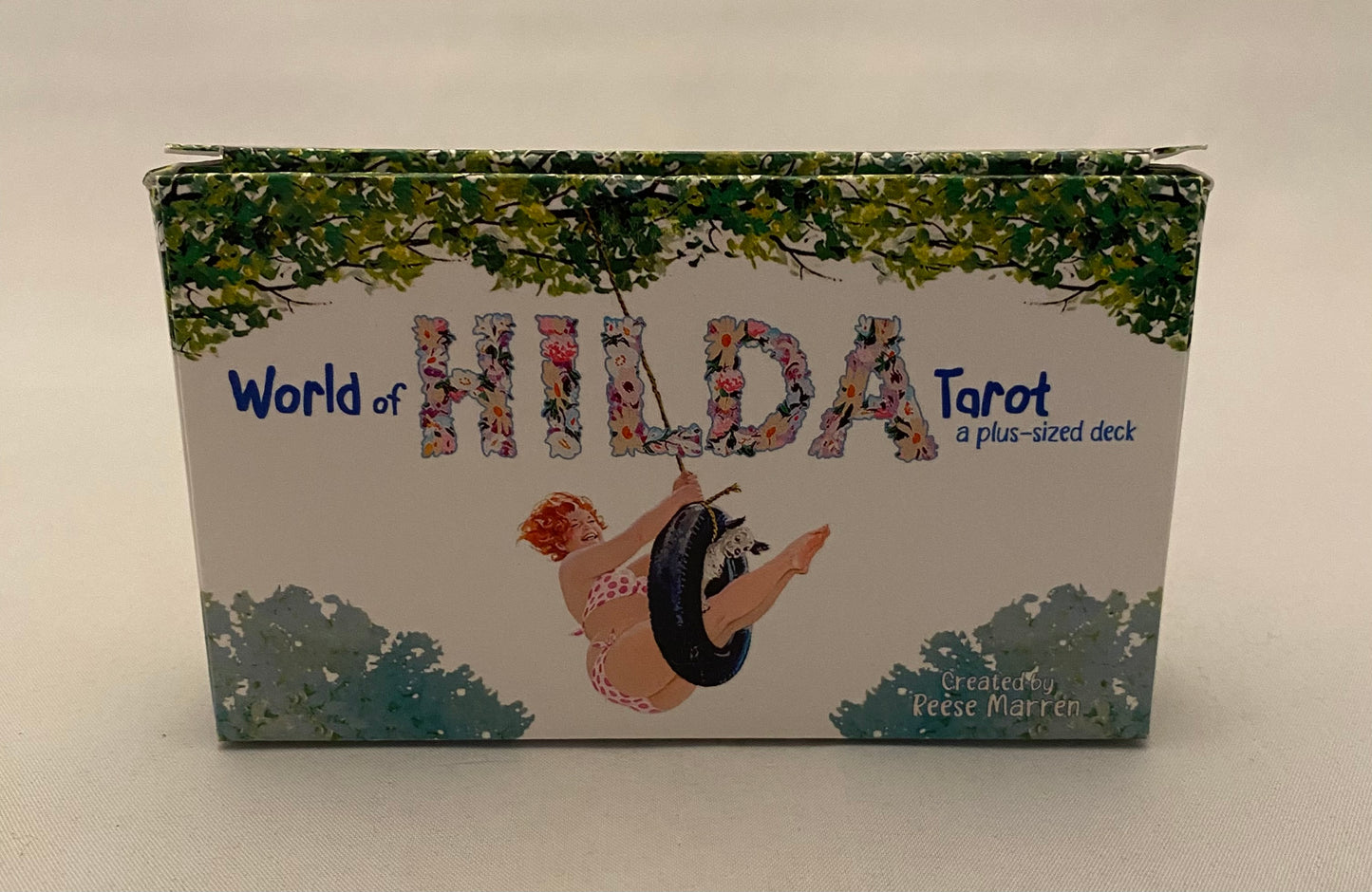 World of Hilda Tarot box with a woman and wolf design on a white background