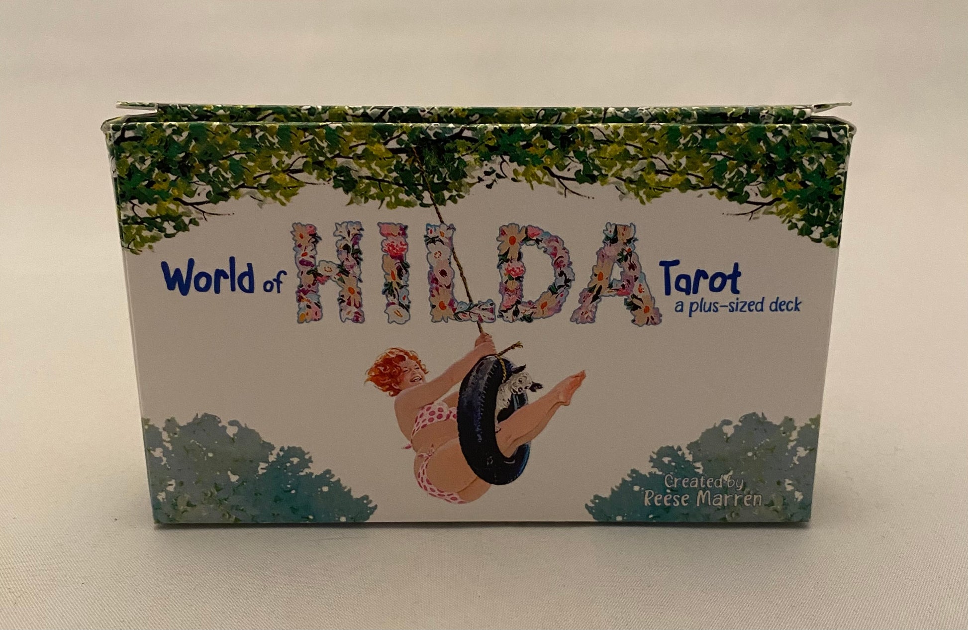 World of Hilda Tarot box with a woman and wolf design on a white background