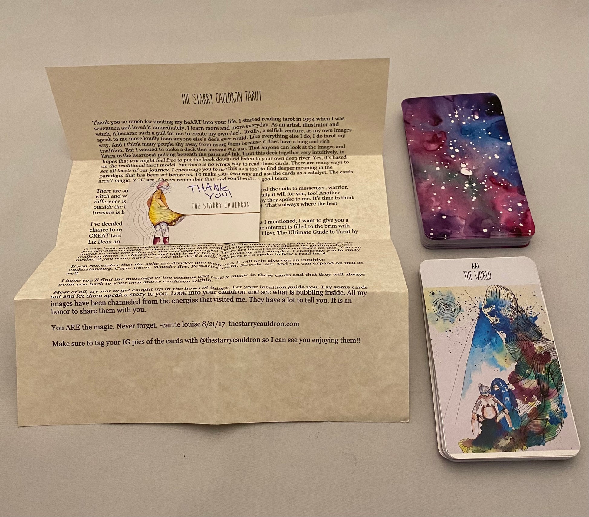 Thank you Letter and tarot cards on a plain surface