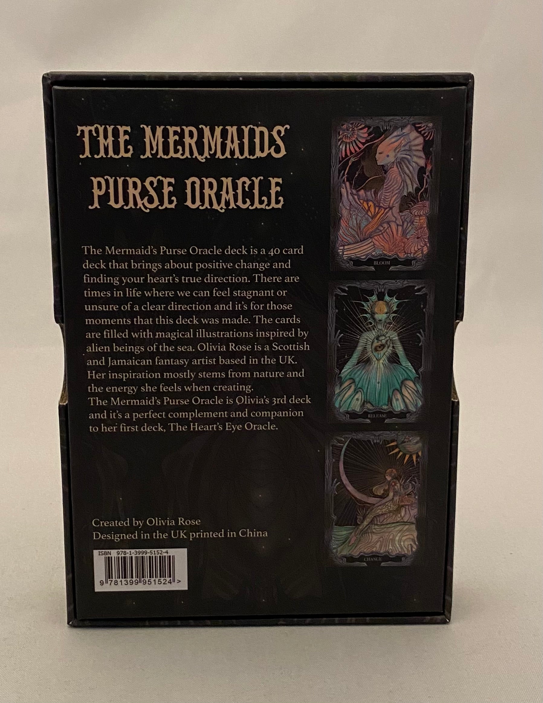 Back of a card deck packaging for 'The Mermaid's Purse Oracle' with text and images of mermaids.
