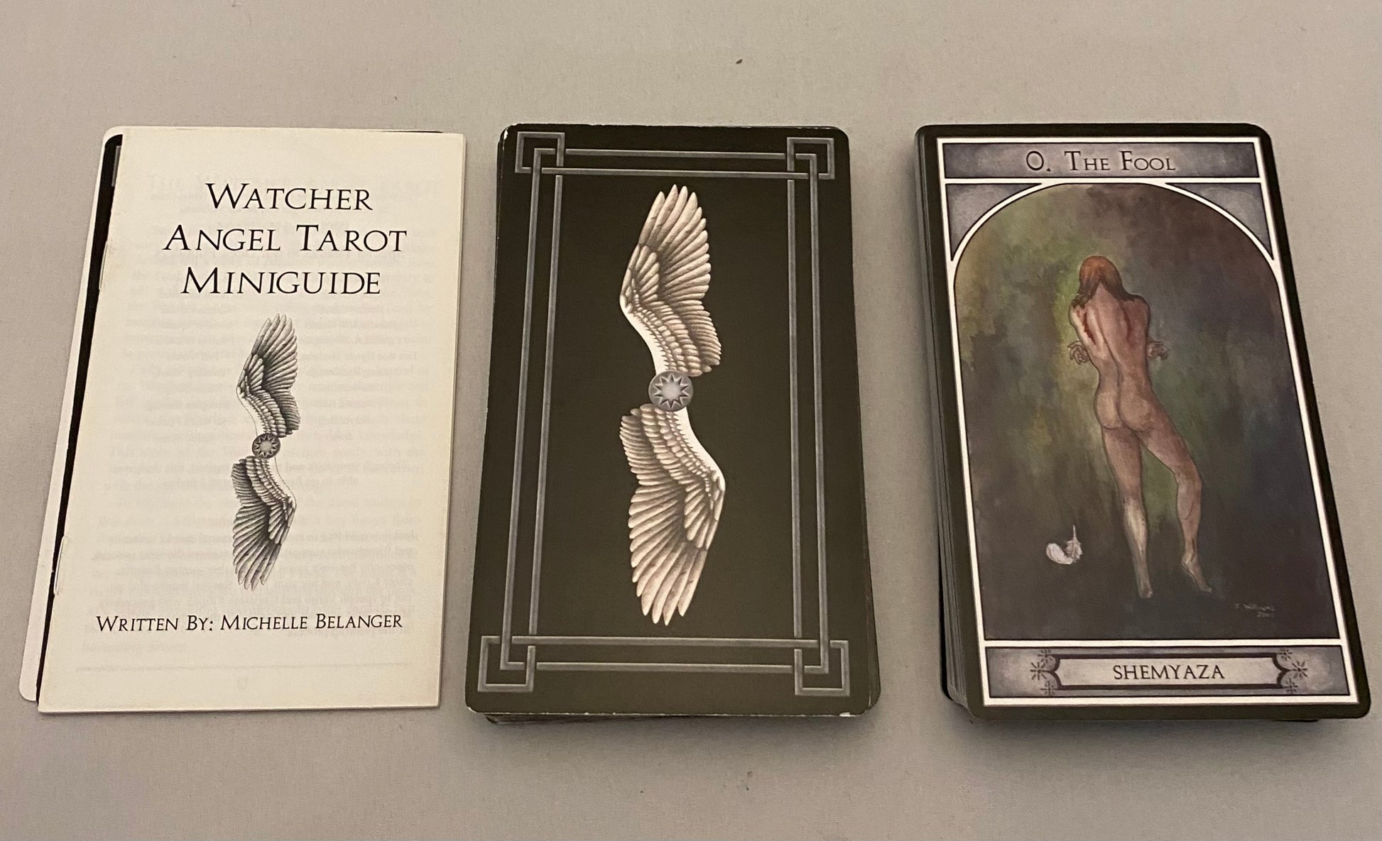 Watcher Angel Tarot Miniguide book with two tarot cards on a gray background