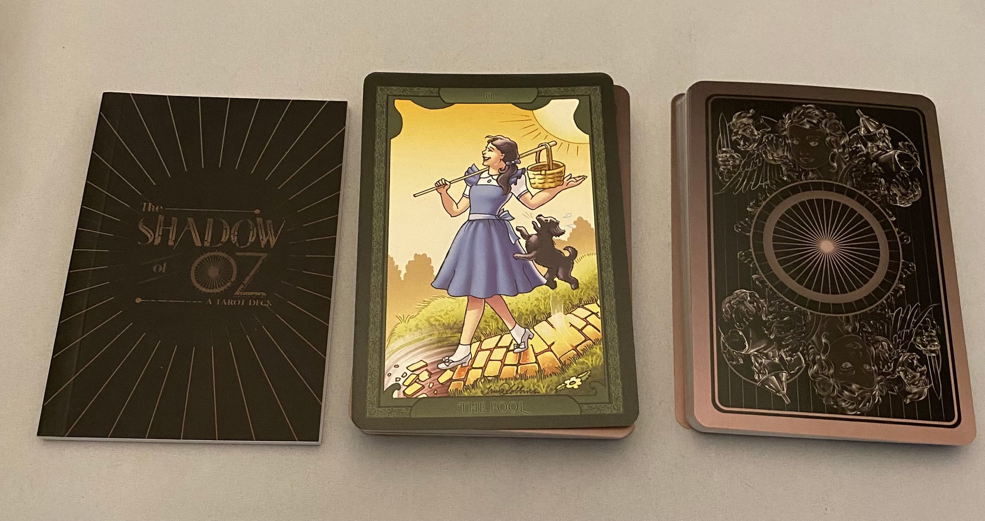 Three cards from a 'The Shadow in Oz' card set on a light gray background.