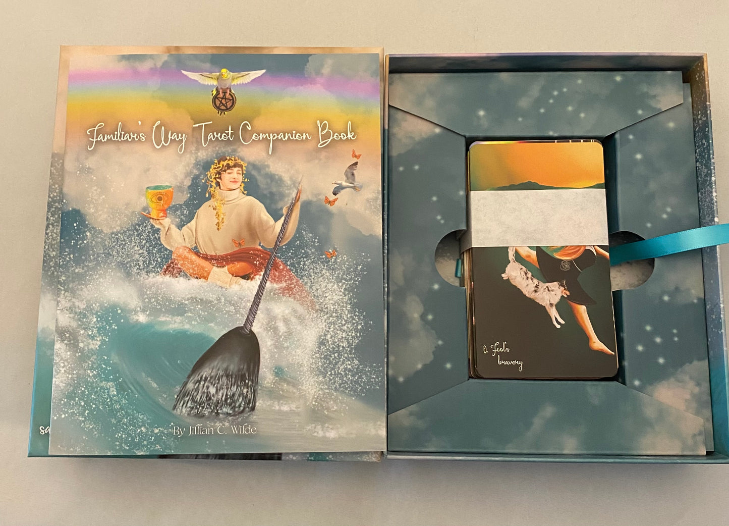 tarot book and card set with artistic cover and packaging.