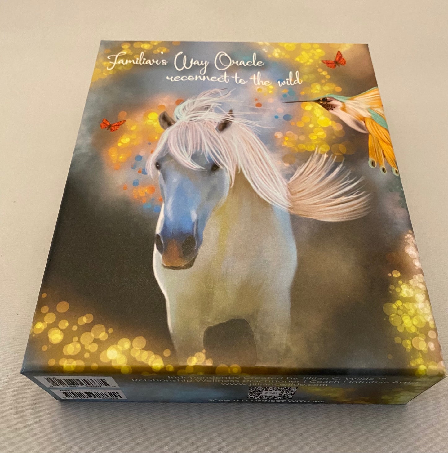Tarot box with a horse illustration and text on a light gray background