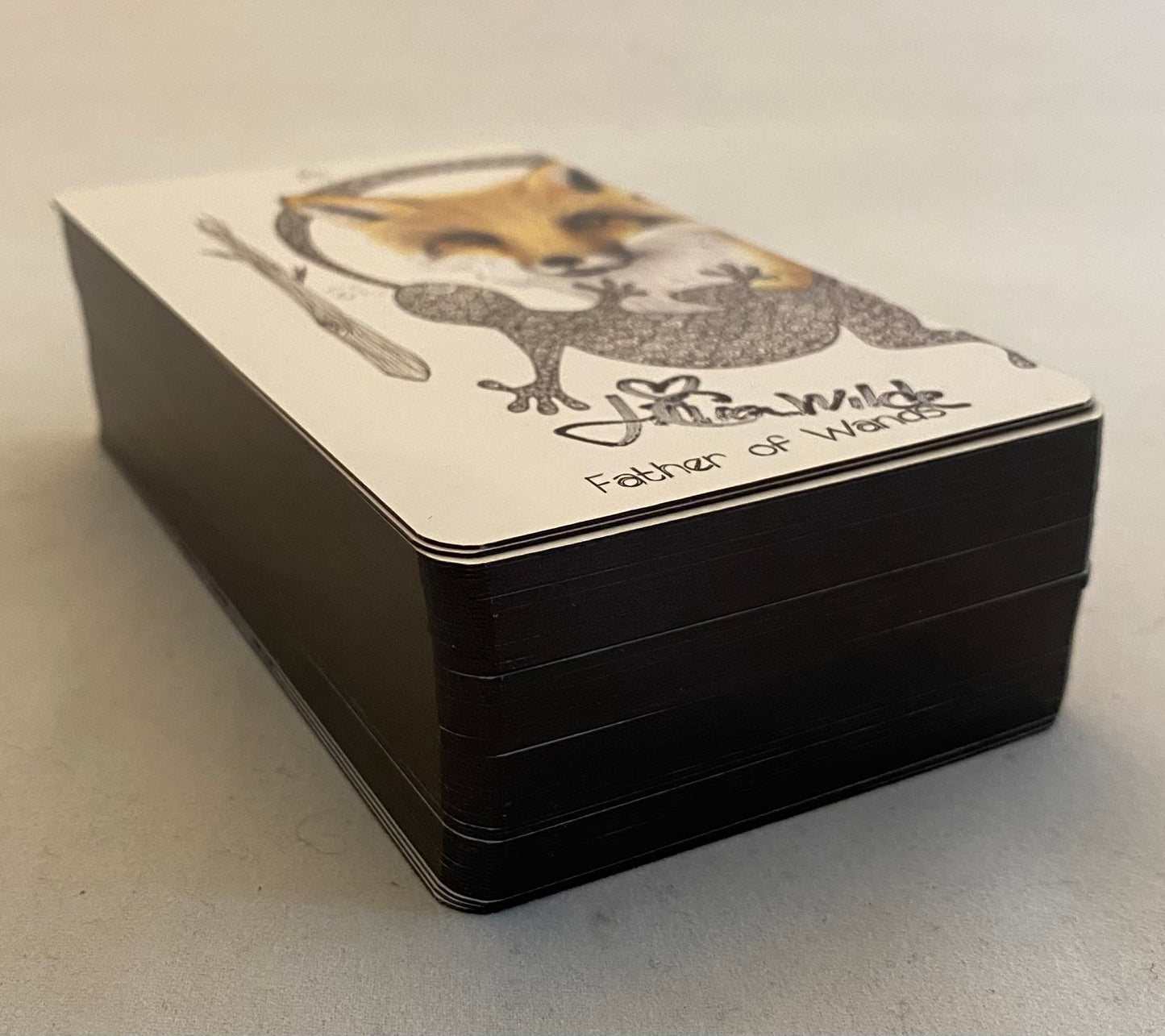 Tarot Card deck with a dog illustration and text on a white background