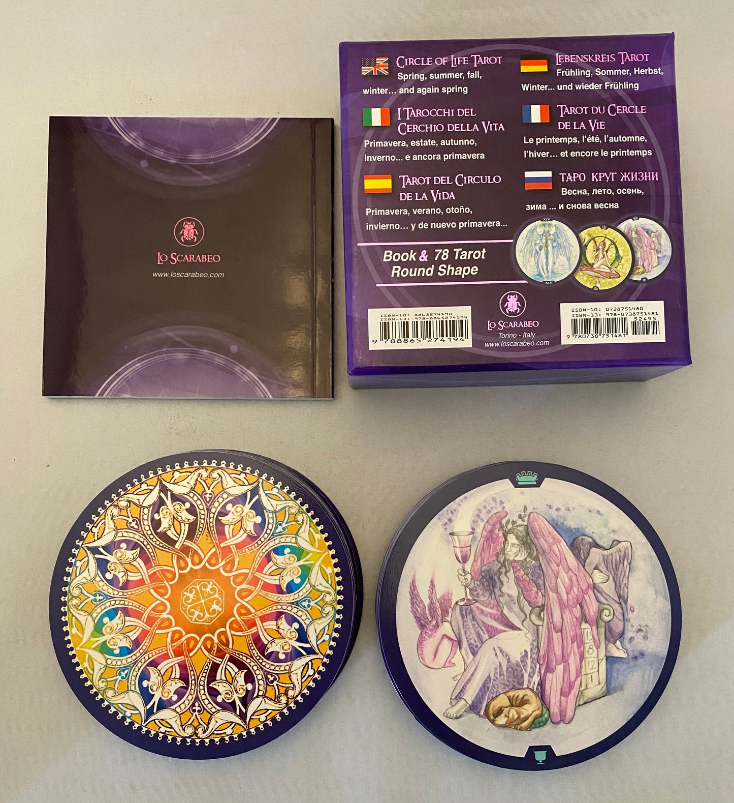 Tarot card packaging with tarot cards and box on a light gray background