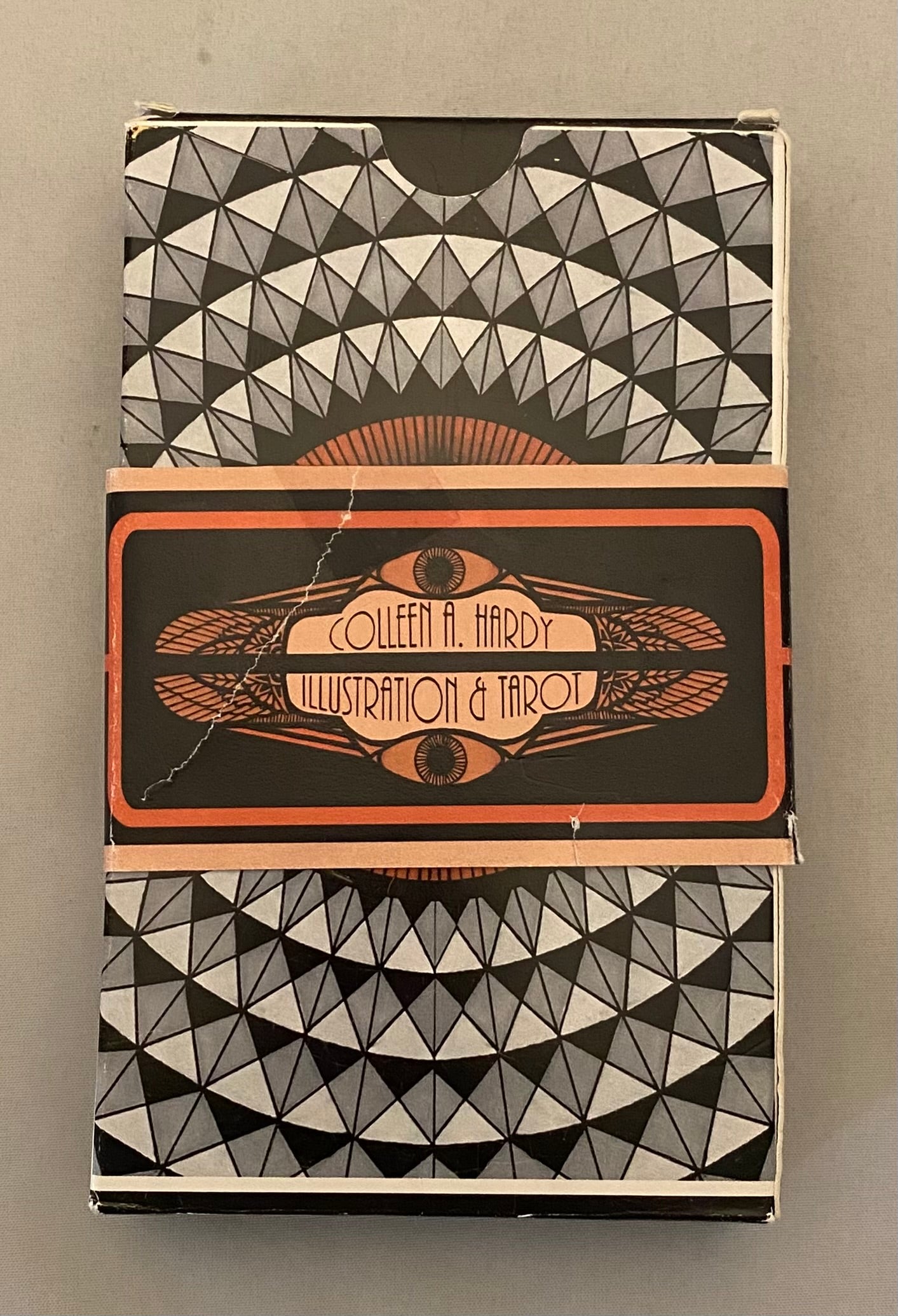 Collection of tarot cards with geometric design and Colleen A. Hardy branding on a gray background