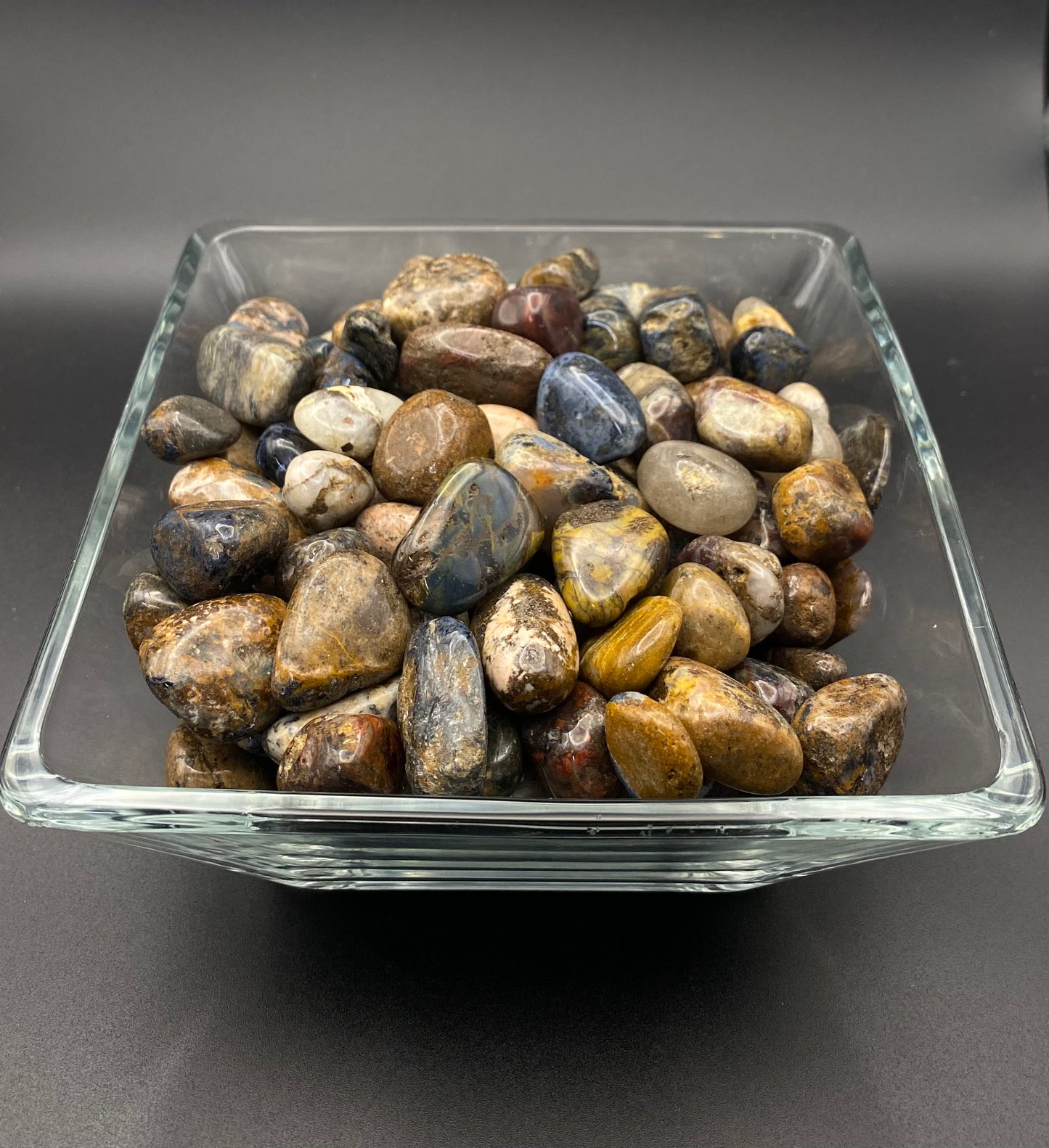 Pietersite in a glass bowl