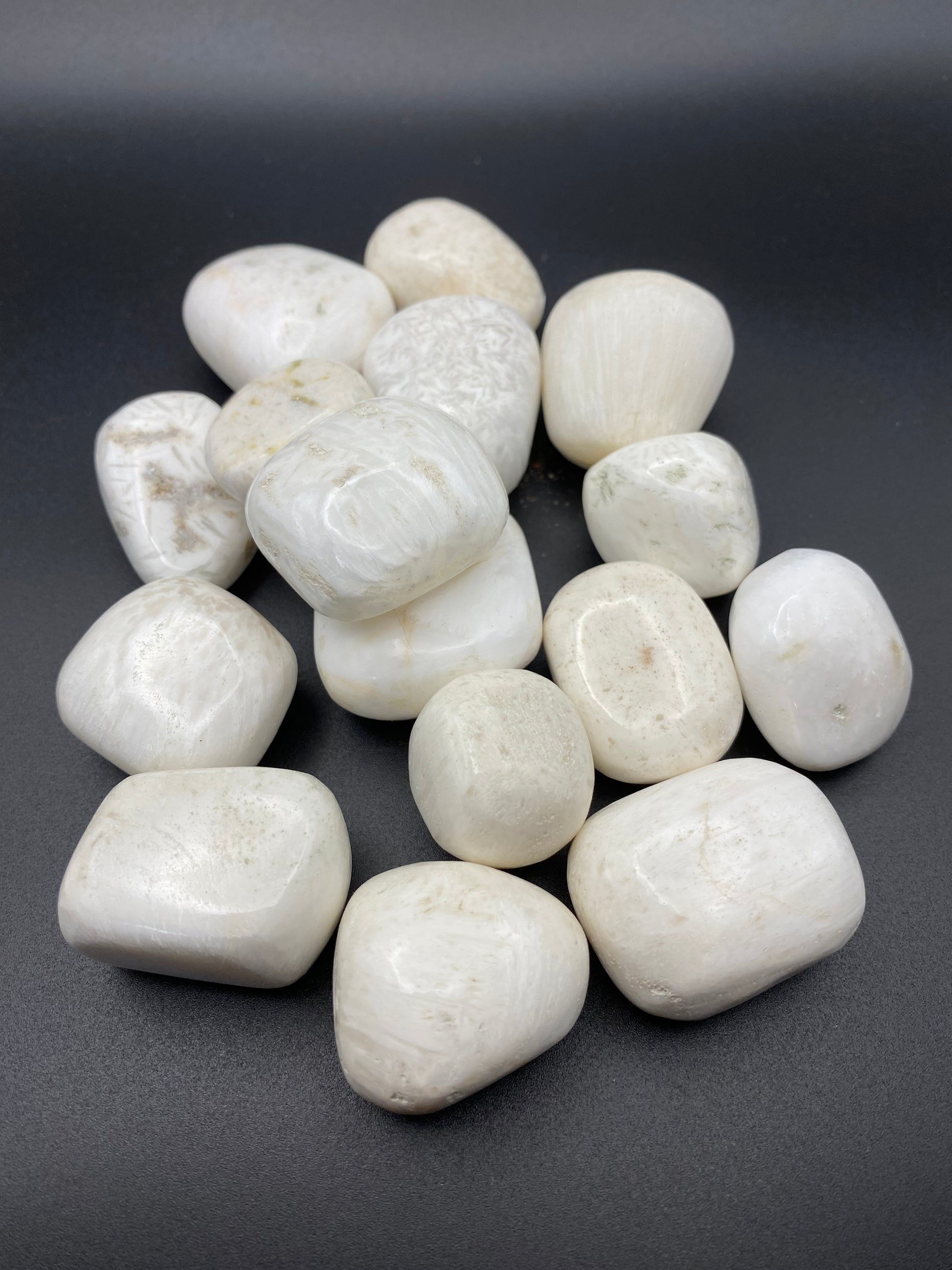 Scolecite stones on a dark gray background